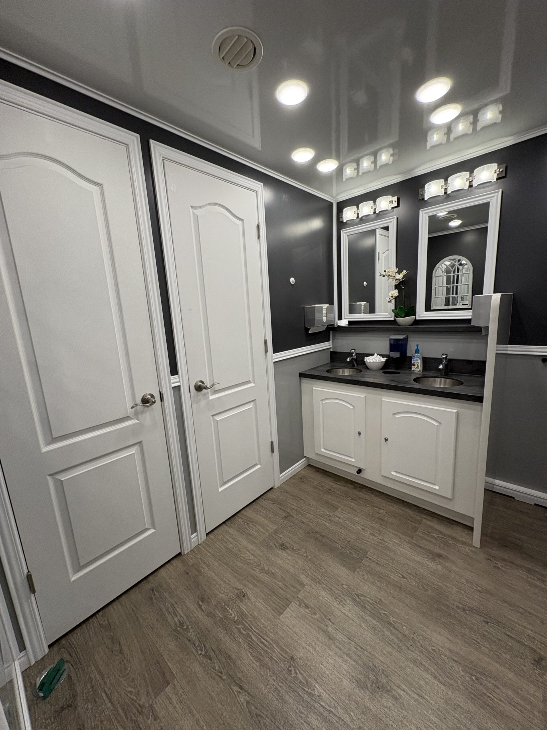 Ten Stall Cottage restroom trailer interior corridor and stalls