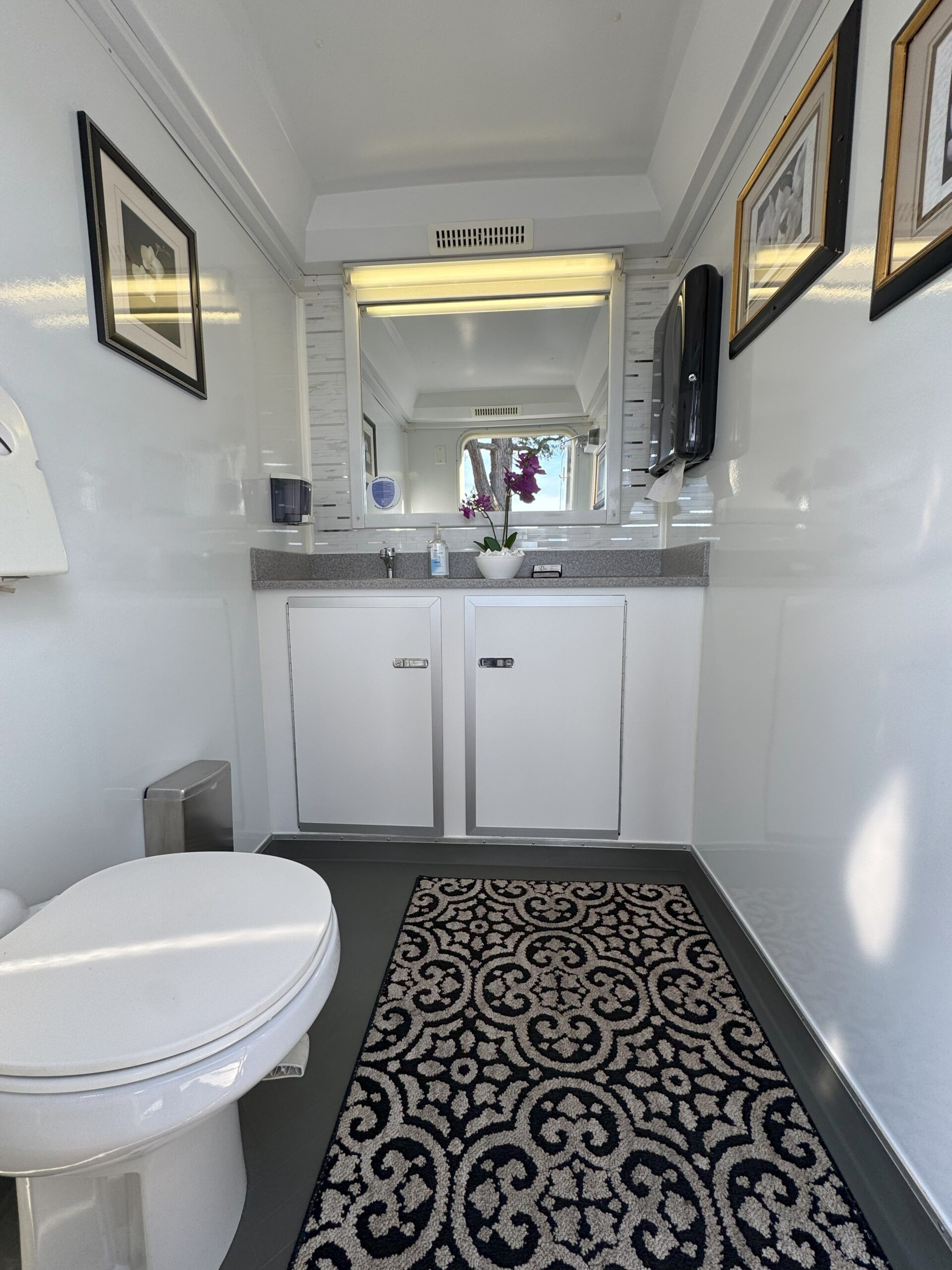 Restroom trailer exterior under blue sky