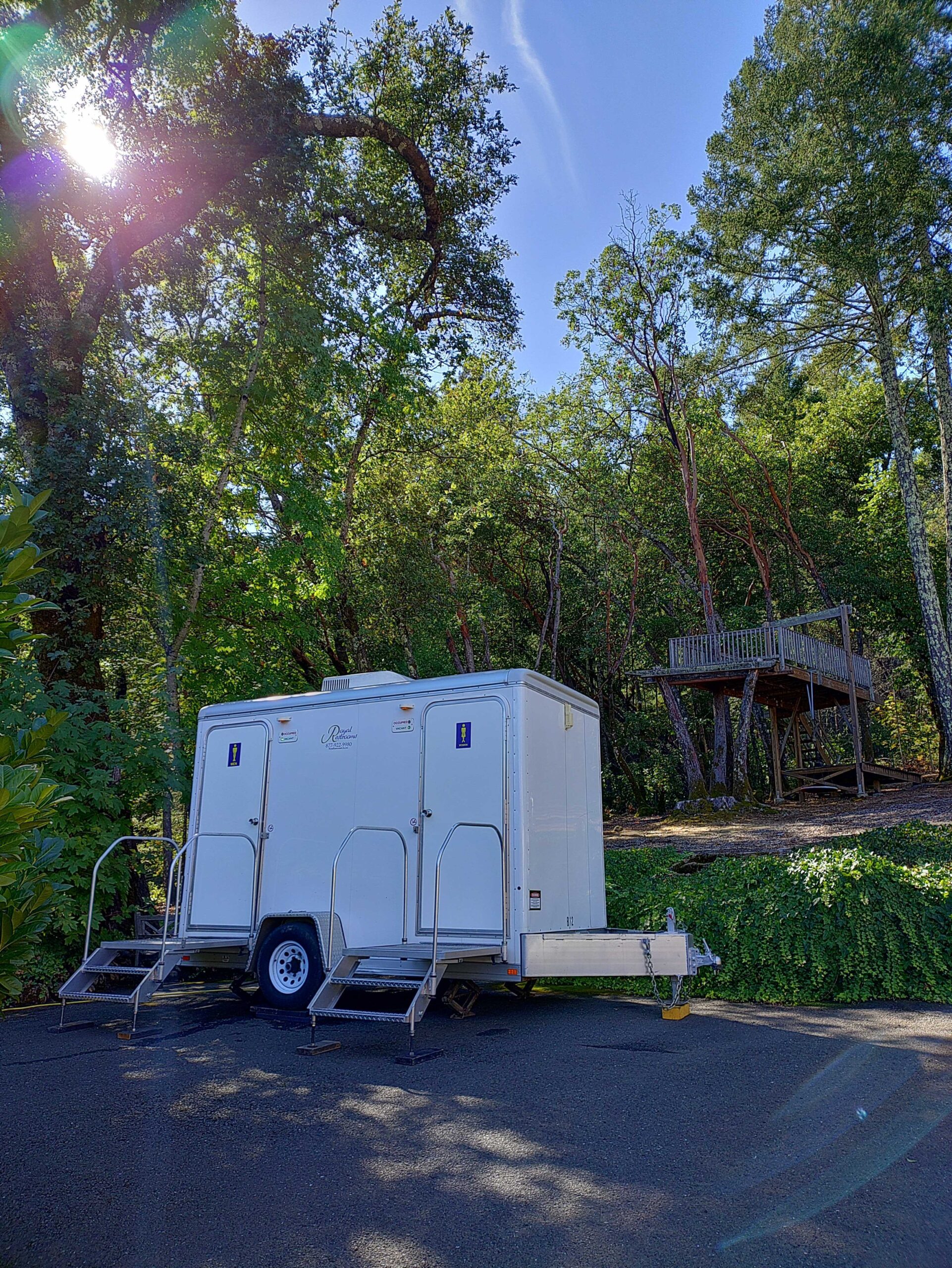 Restroom trailer interior, stall and vanity perspective
